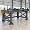 Custom fabricated steel support frame with bracing and mounting plates for production equipment